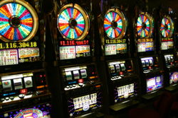 A row of "Wheel of Fortune" slot machines in a casino in Las Vegas. This specific slot machine is loosely based on the TV game show